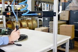 a man working on a machine in a factory