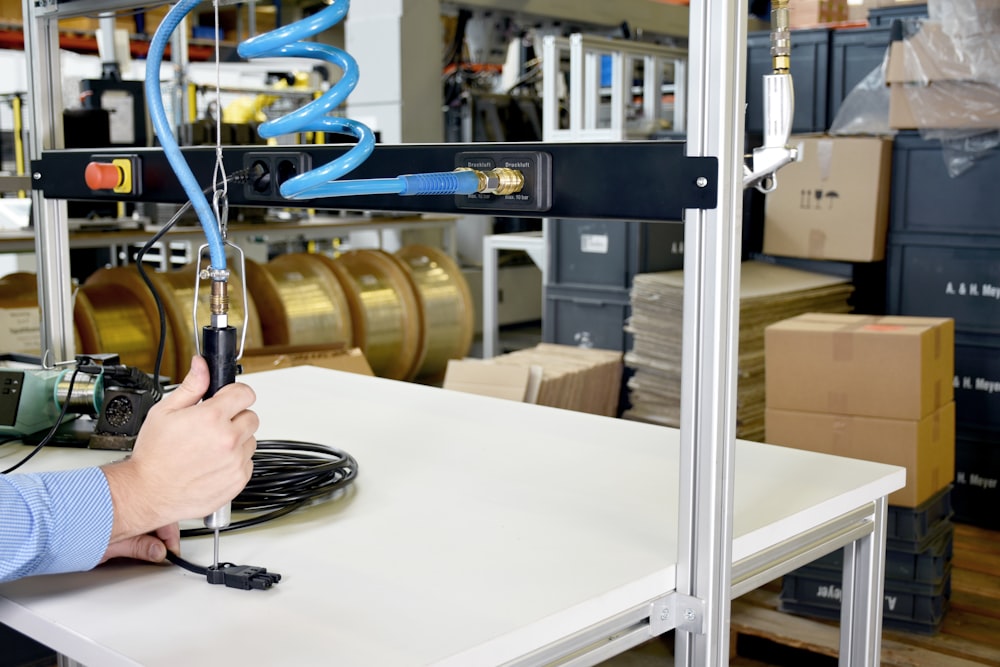 a man working on a machine in a factory