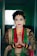 a woman in a green and red outfit