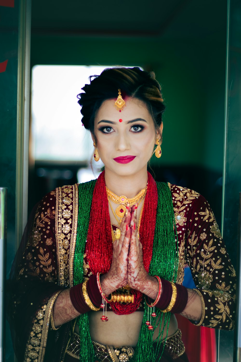 a woman in a green and red outfit