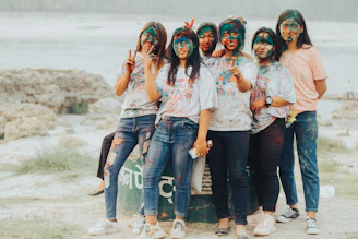 a group of young women standing next to each other