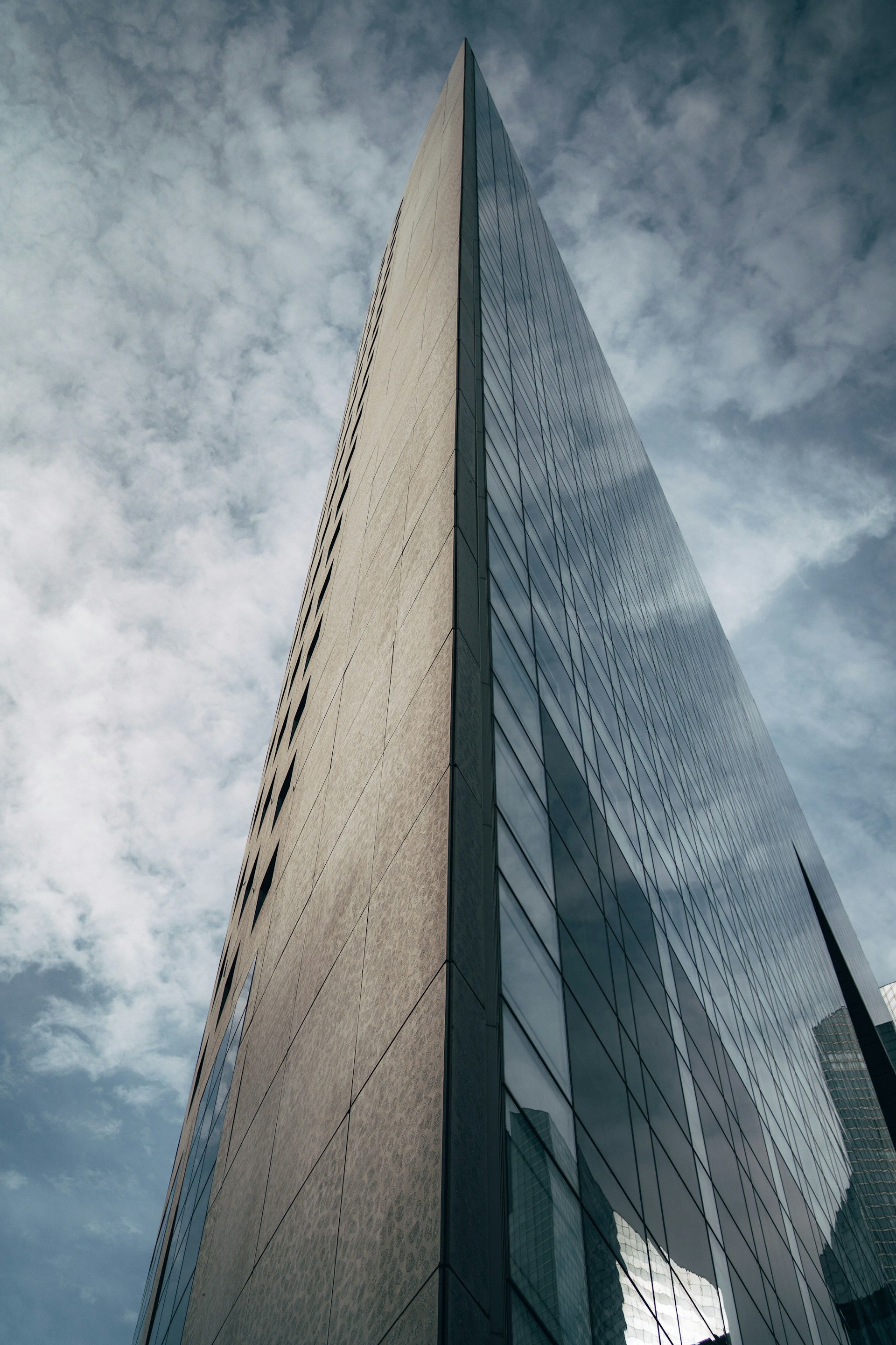 a tall building with a sky background
