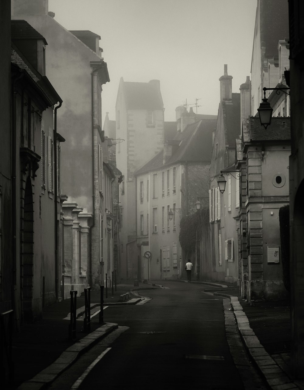 a black and white photo of a city street