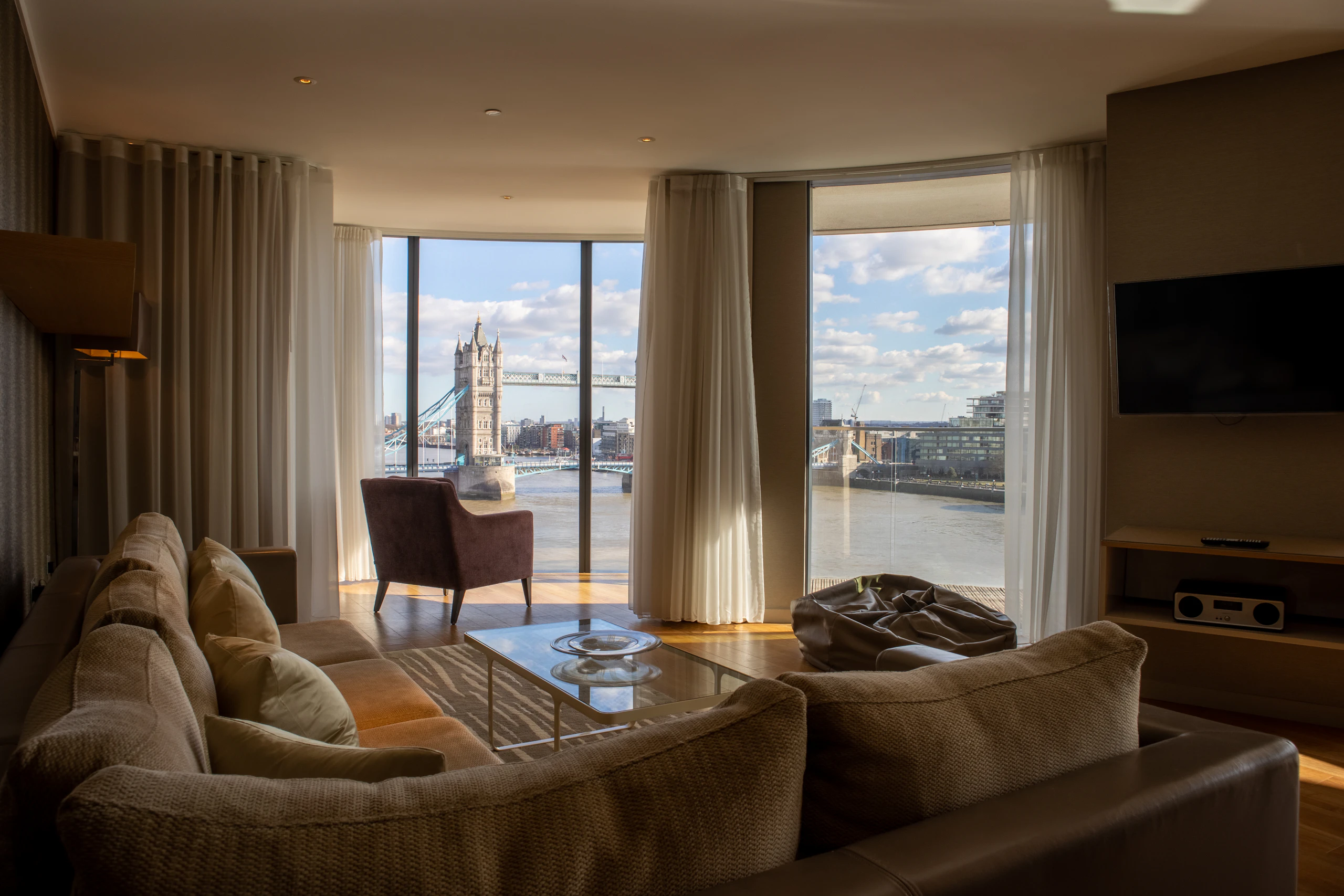 Living room arranged around a large window