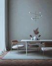 Modern dining table with matching modular chairs in a minimalist setting
