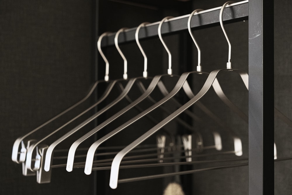 a bunch of clothes hangers in a closet