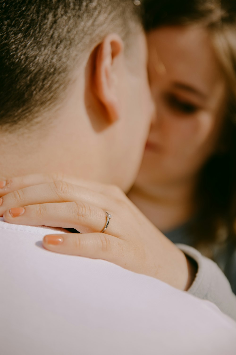 a close up of a person with a ring on their finger