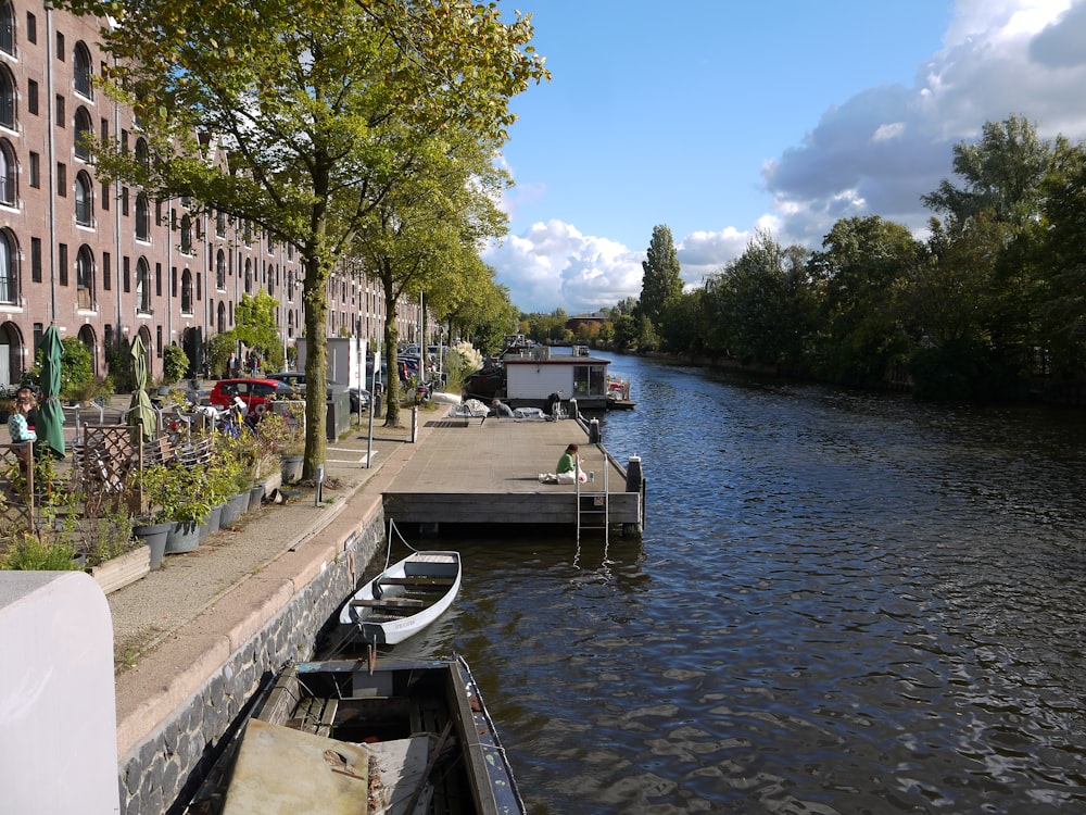 a boat is docked at the end of a river