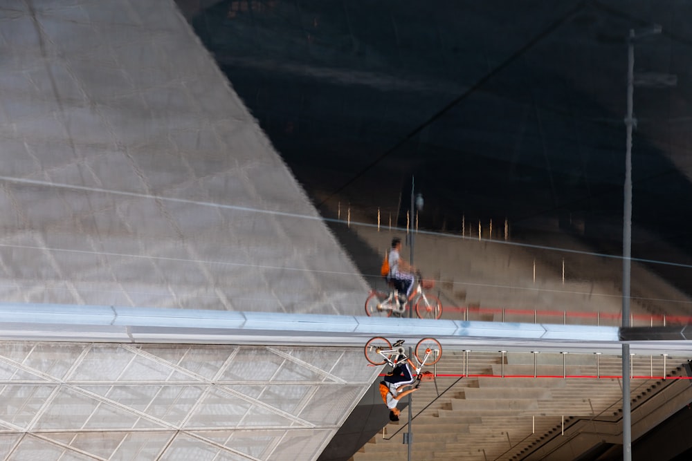 a man riding a bike down a flight of stairs