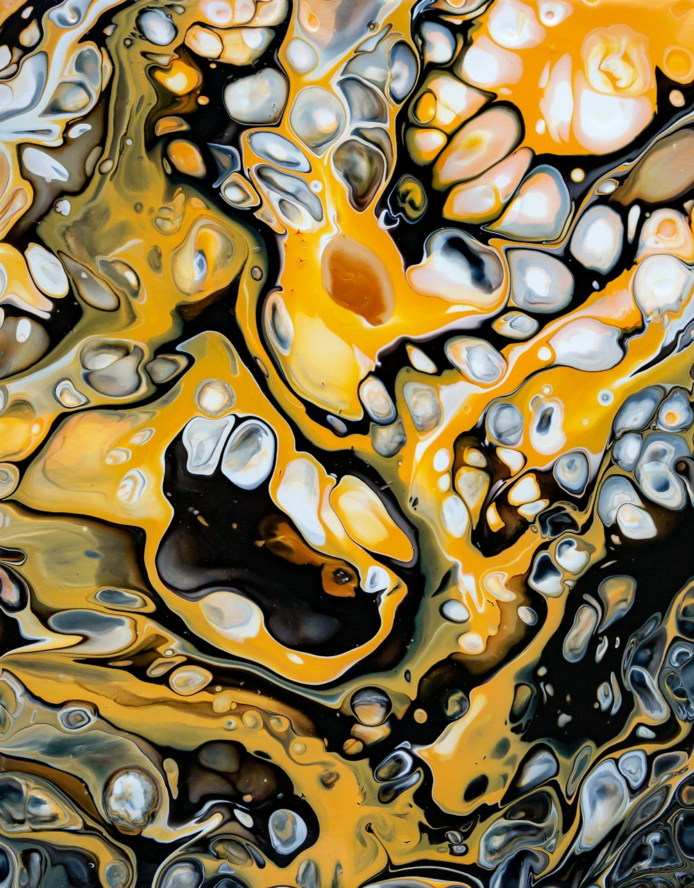 an abstract painting of yellow and black bubbles