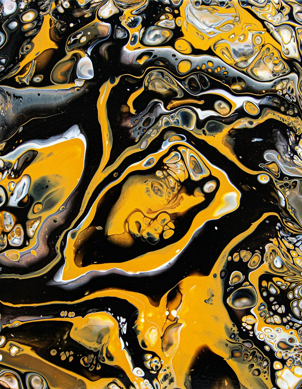 a close up view of a yellow and black liquid