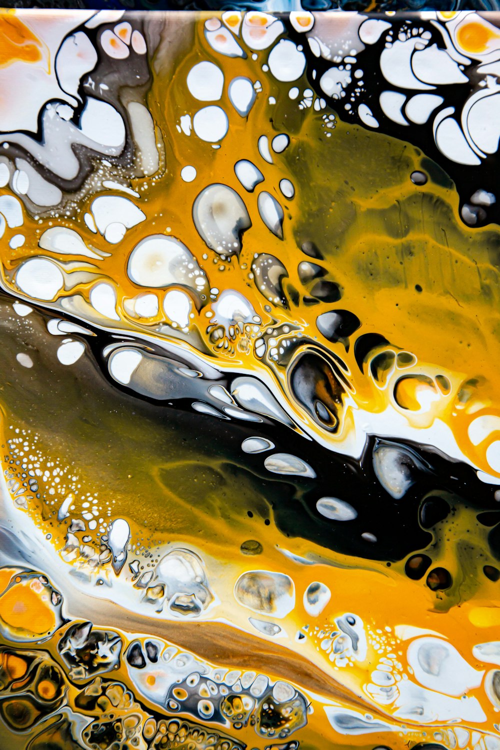 a close up of a yellow and black liquid