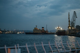 a large ship in a harbor at night