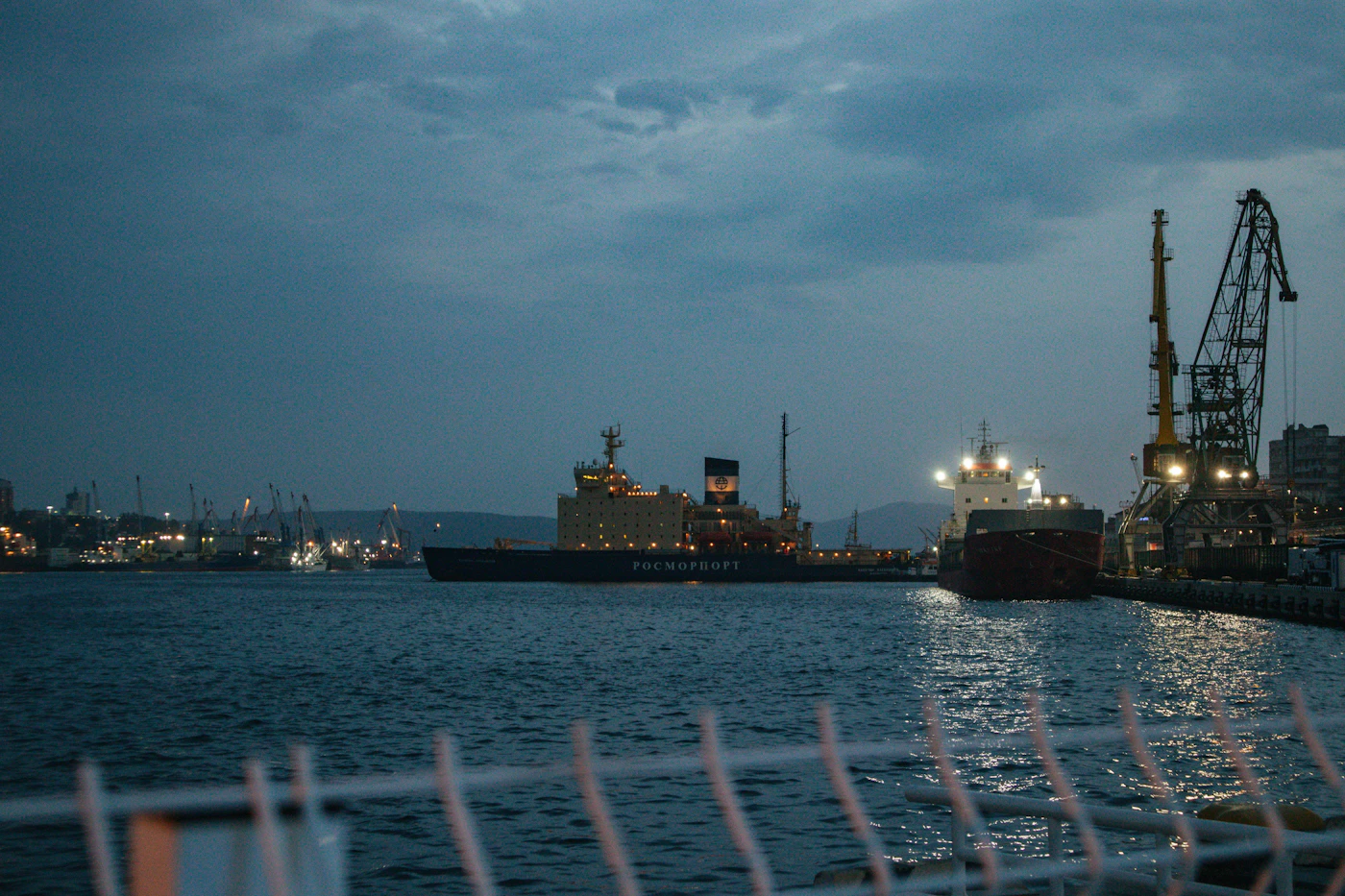 Large vessel docked in a harbor at night, representing the longshore and harbor work covered by the LHWCA