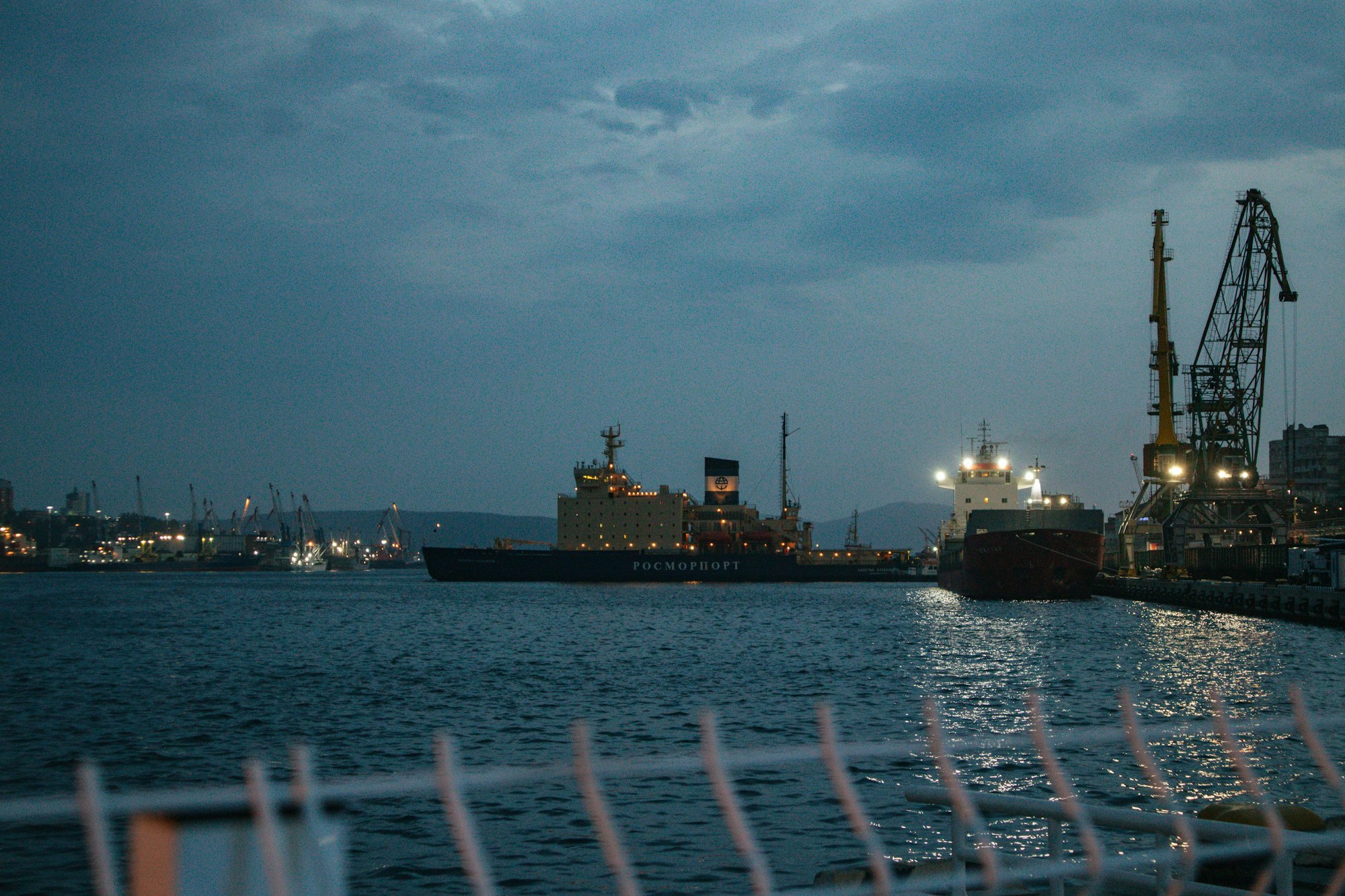 a large ship in a harbor at night