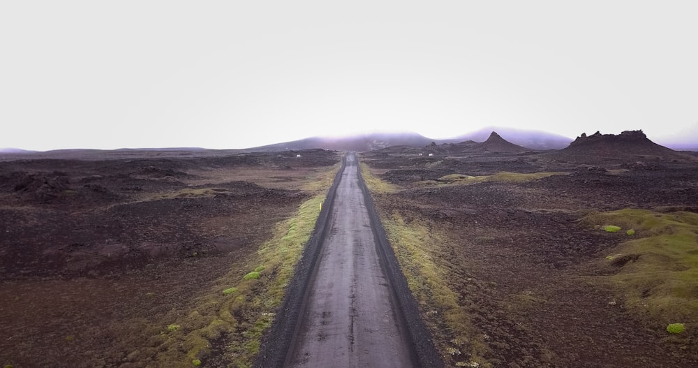 an aerial view of a road in the middle of nowhere