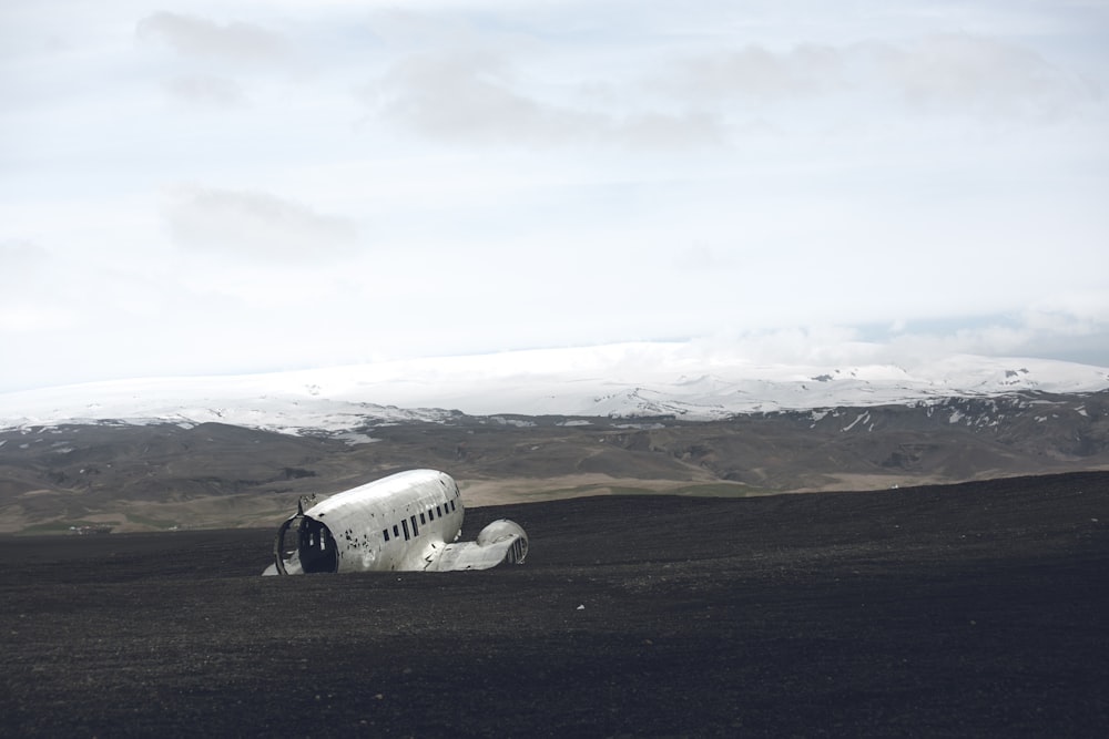 a small airplane sitting in the middle of a field