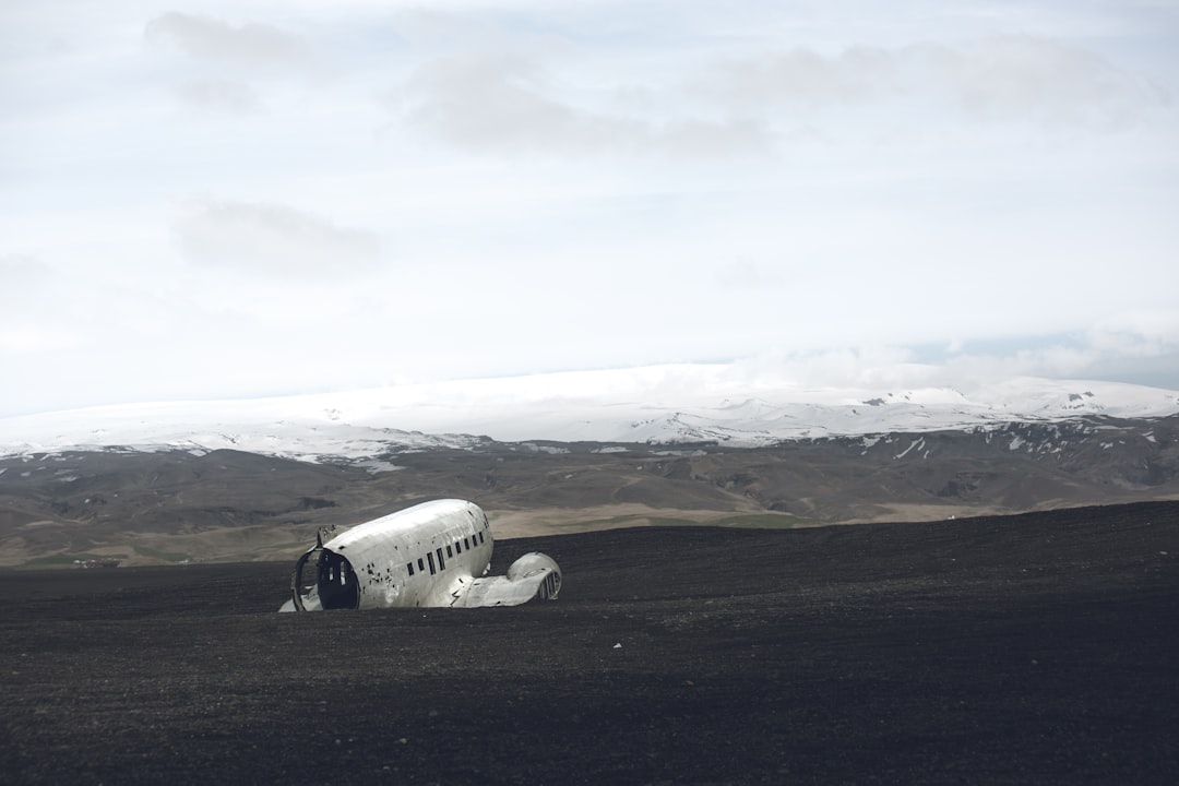 a small airplane sitting in the middle of a field,
