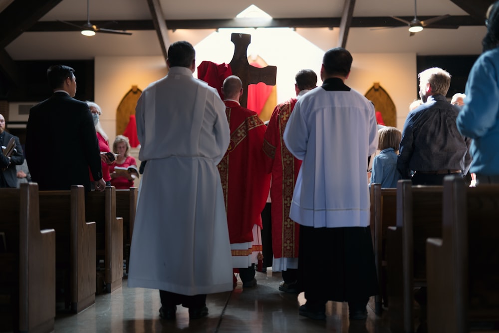 a group of people that are standing in a church