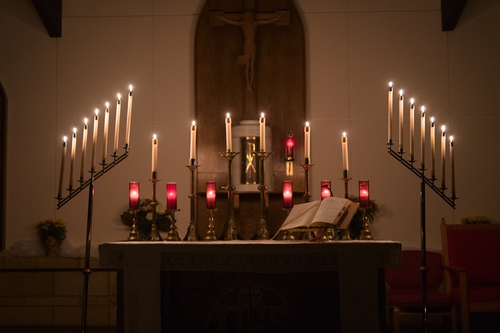 a bunch of candles that are on a table