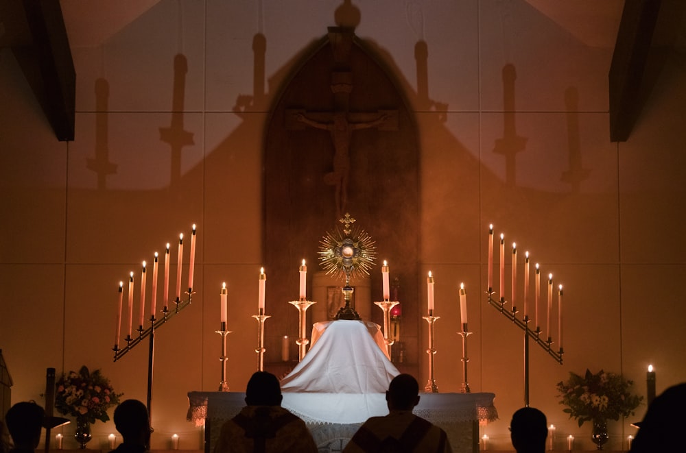 a bride and groom at the alter of a church
