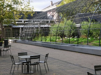 Outdoor communal area with seating and greenery.