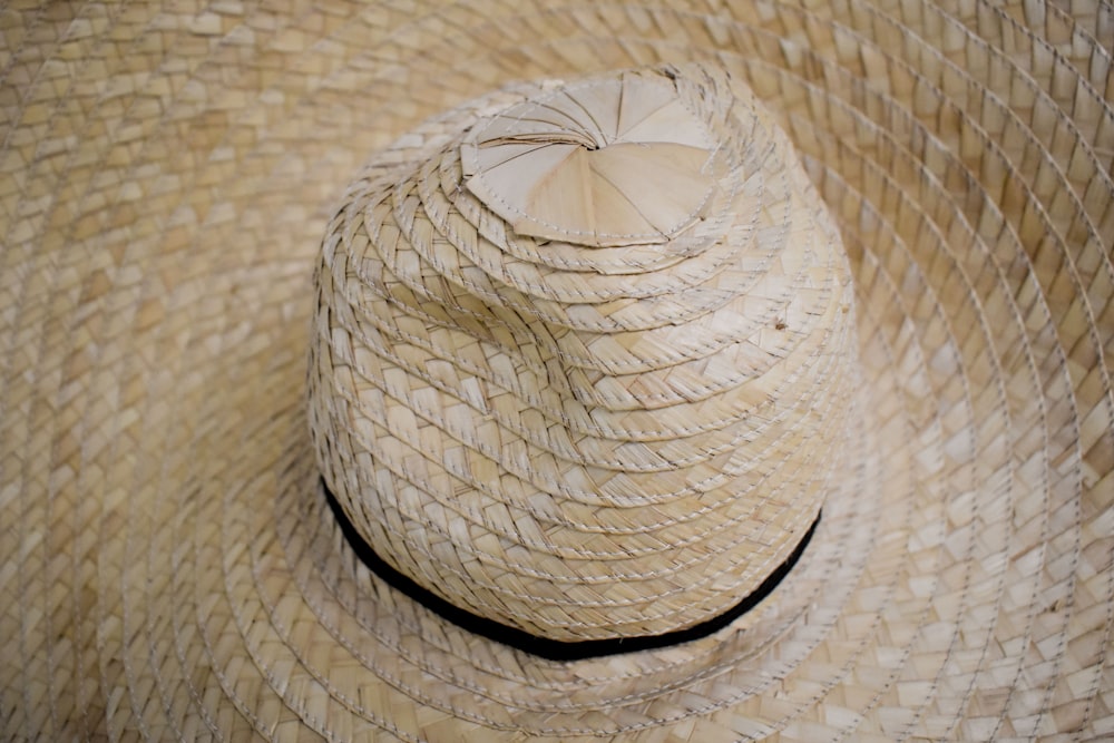 a straw hat with a bow on top of it