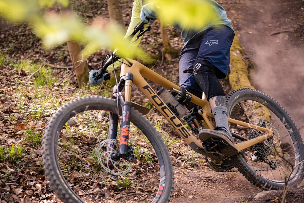 a person riding a bike on a trail