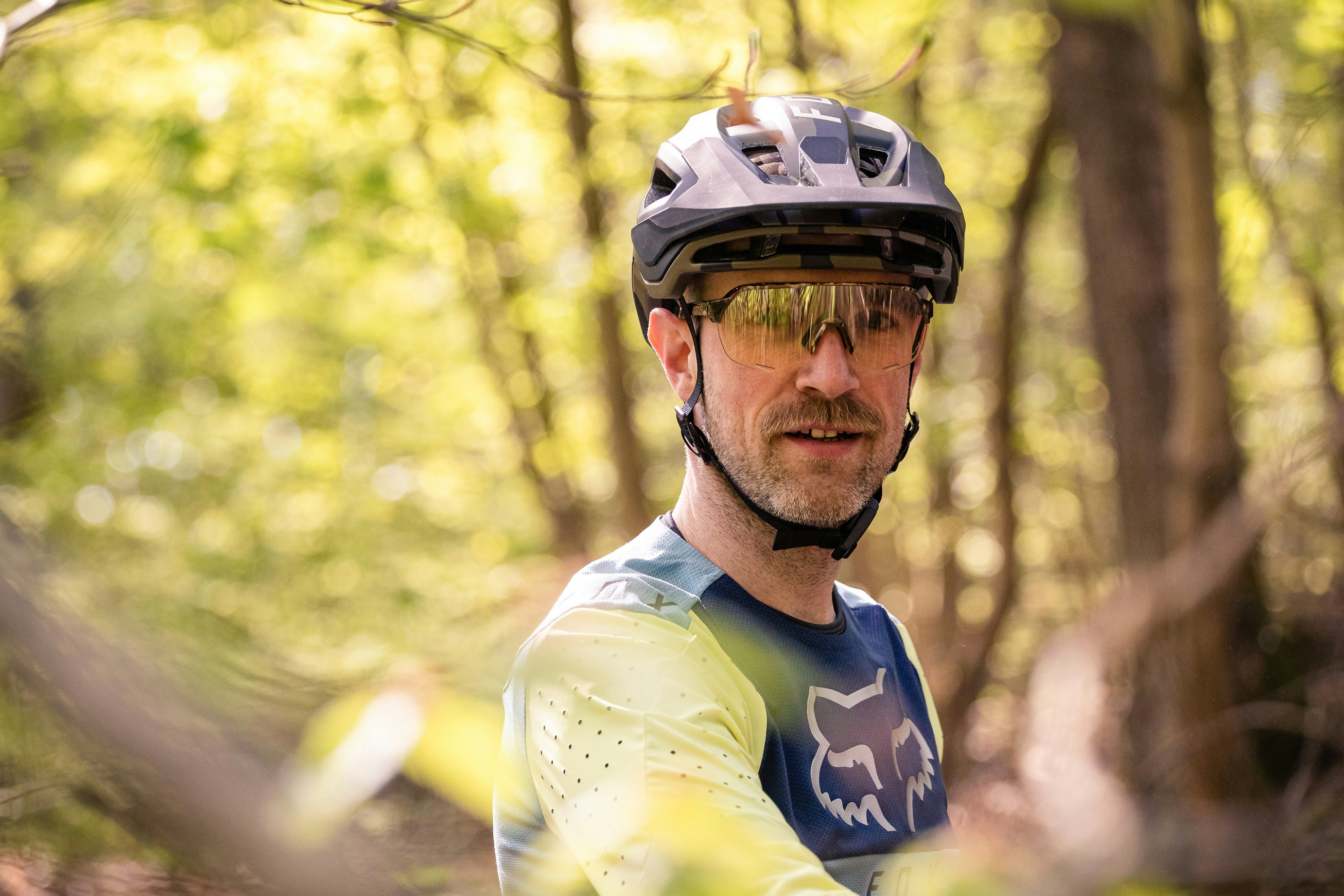Stuttgart area, Baden-Württemberg, Germany: Portrait of a male mountain biker in the forest on a sunny spring day.