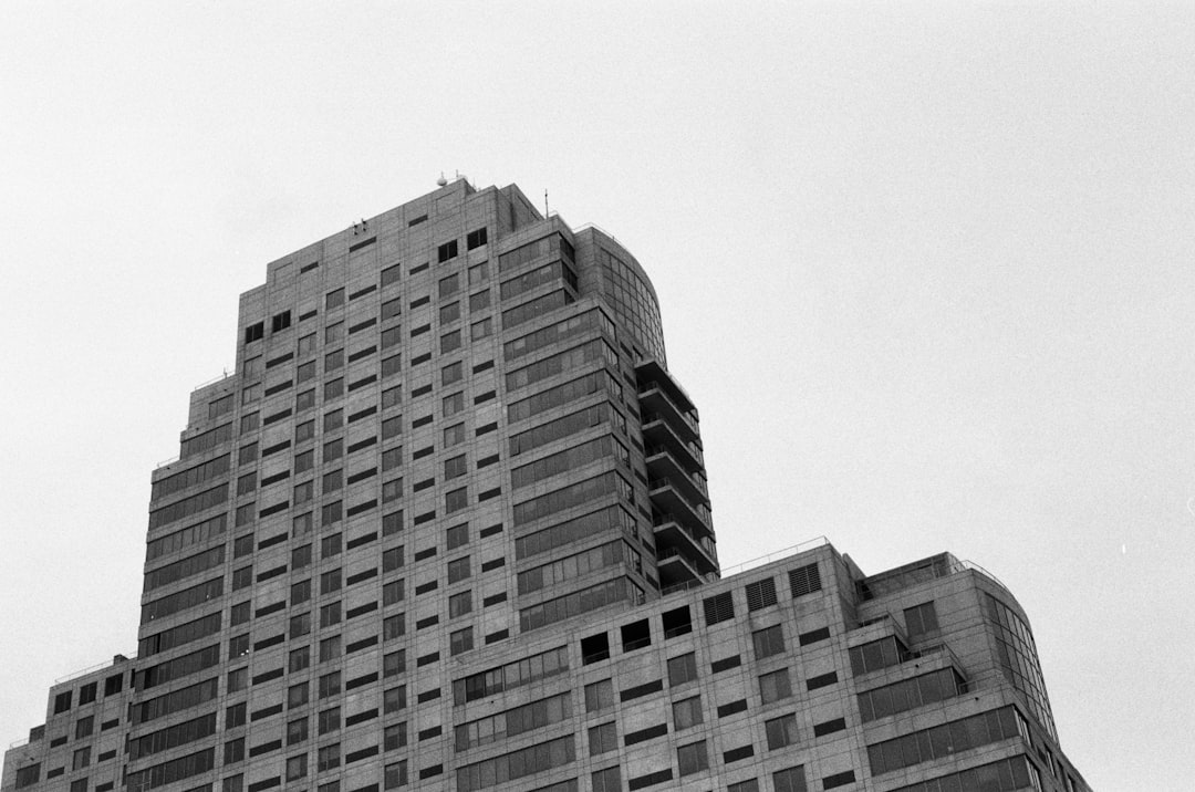 a black and white photo of a very tall building,