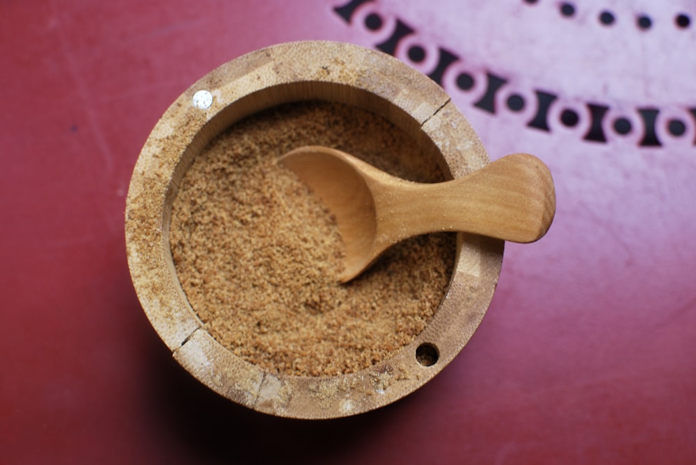 a wooden spoon inside of a wooden bowl