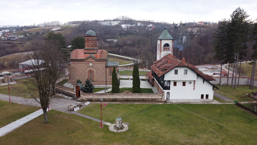 an aerial view of a church with a steeple