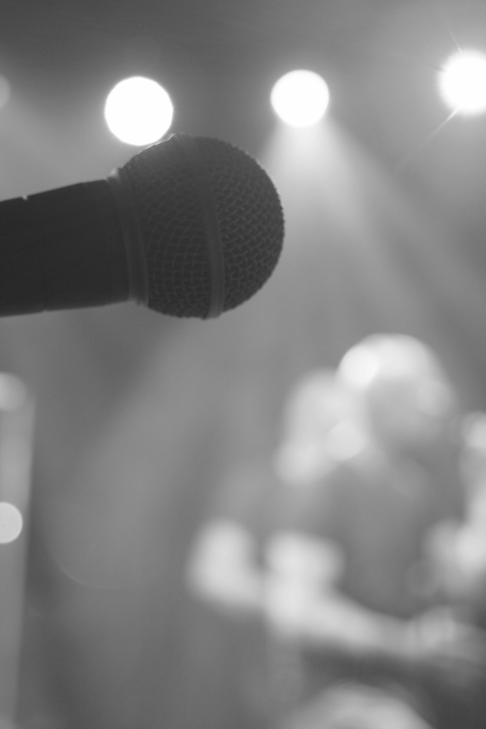 a microphone that is sitting in front of a stage