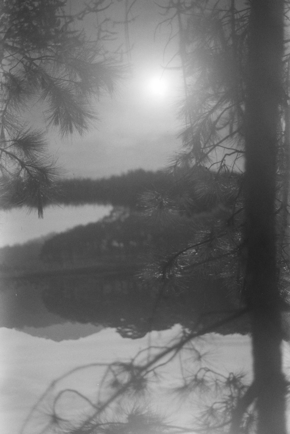 a black and white photo of a boat in the water