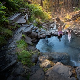 a couple of people that are in some water