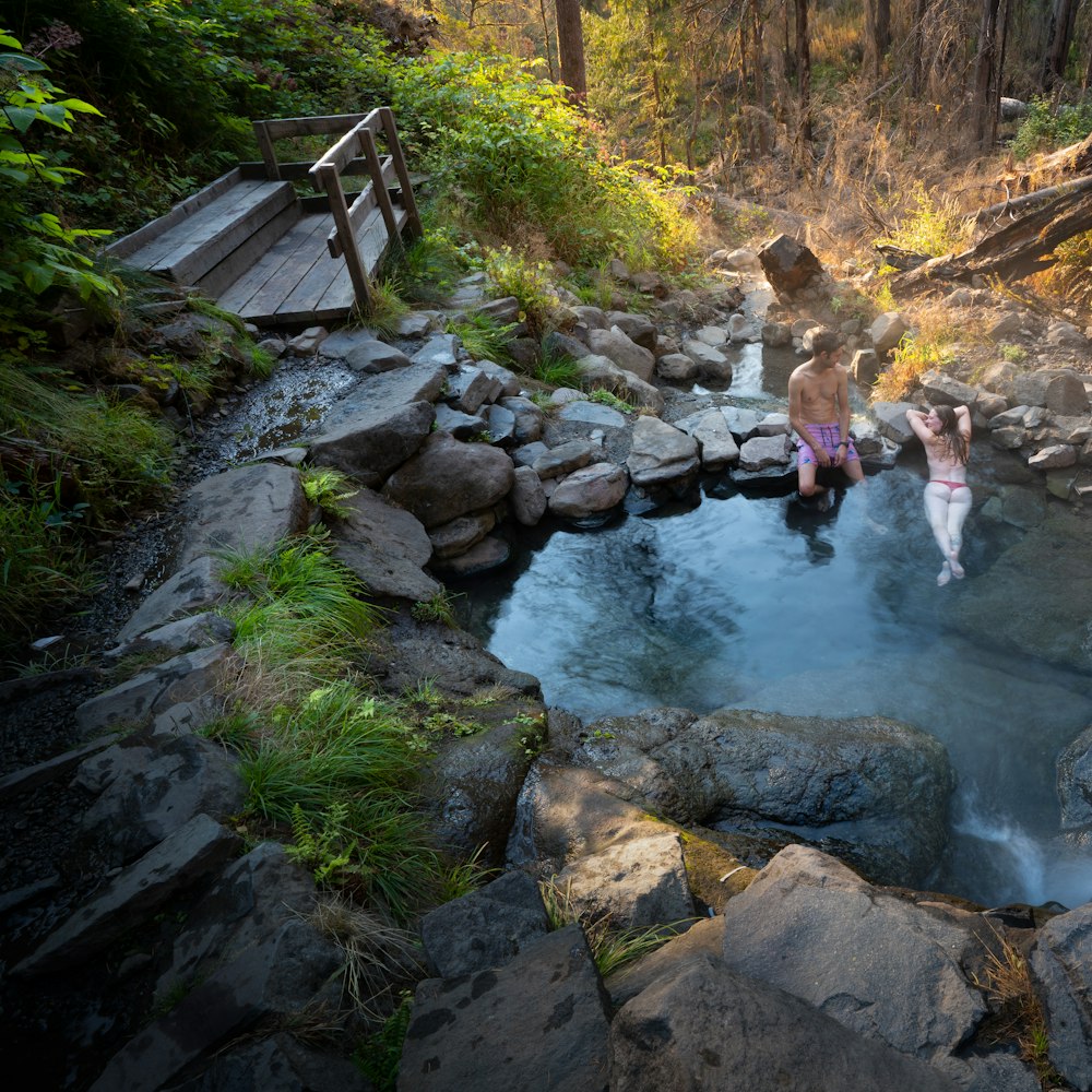 a couple of people that are in some water