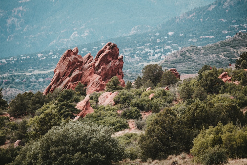 a mountain range with trees and mountains in the background