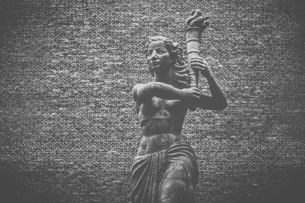 a black and white photo of a statue