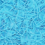 a large pile of blue plastic shards