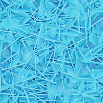 a large pile of blue plastic shards