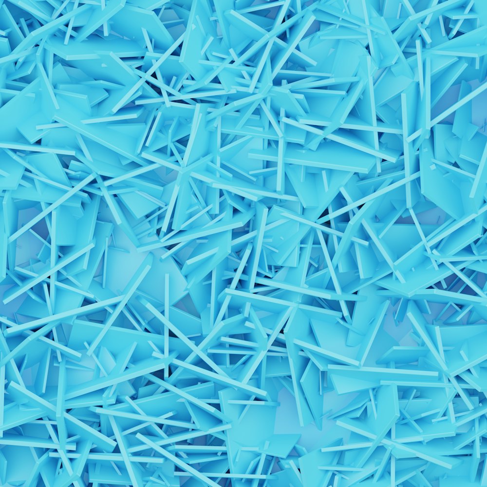 a large pile of blue plastic shards