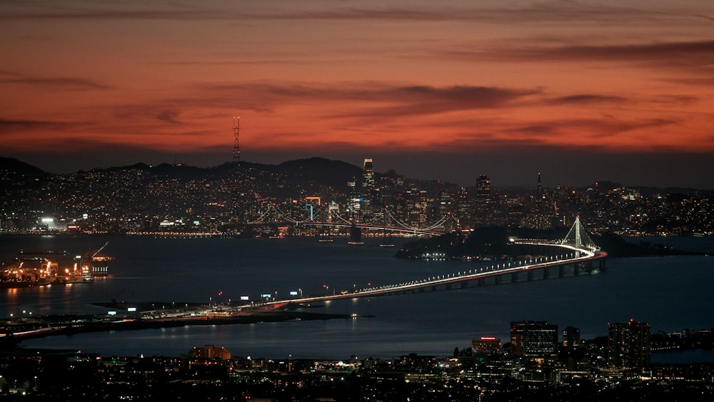 a view of a city and a bridge at night