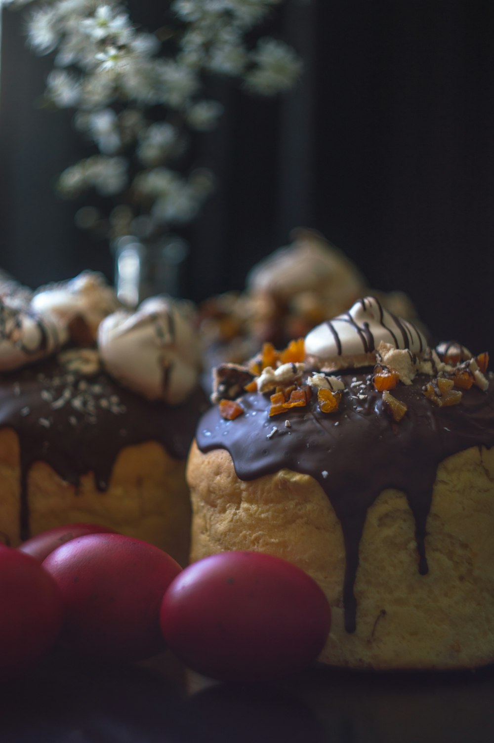 a table topped with cakes covered in frosting