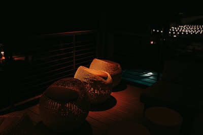 Soft outdoor lighting illuminating a modern patio area at dusk.