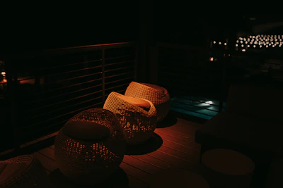 Outdoor patio with cozy seating and soft ambient lighting at dusk.
