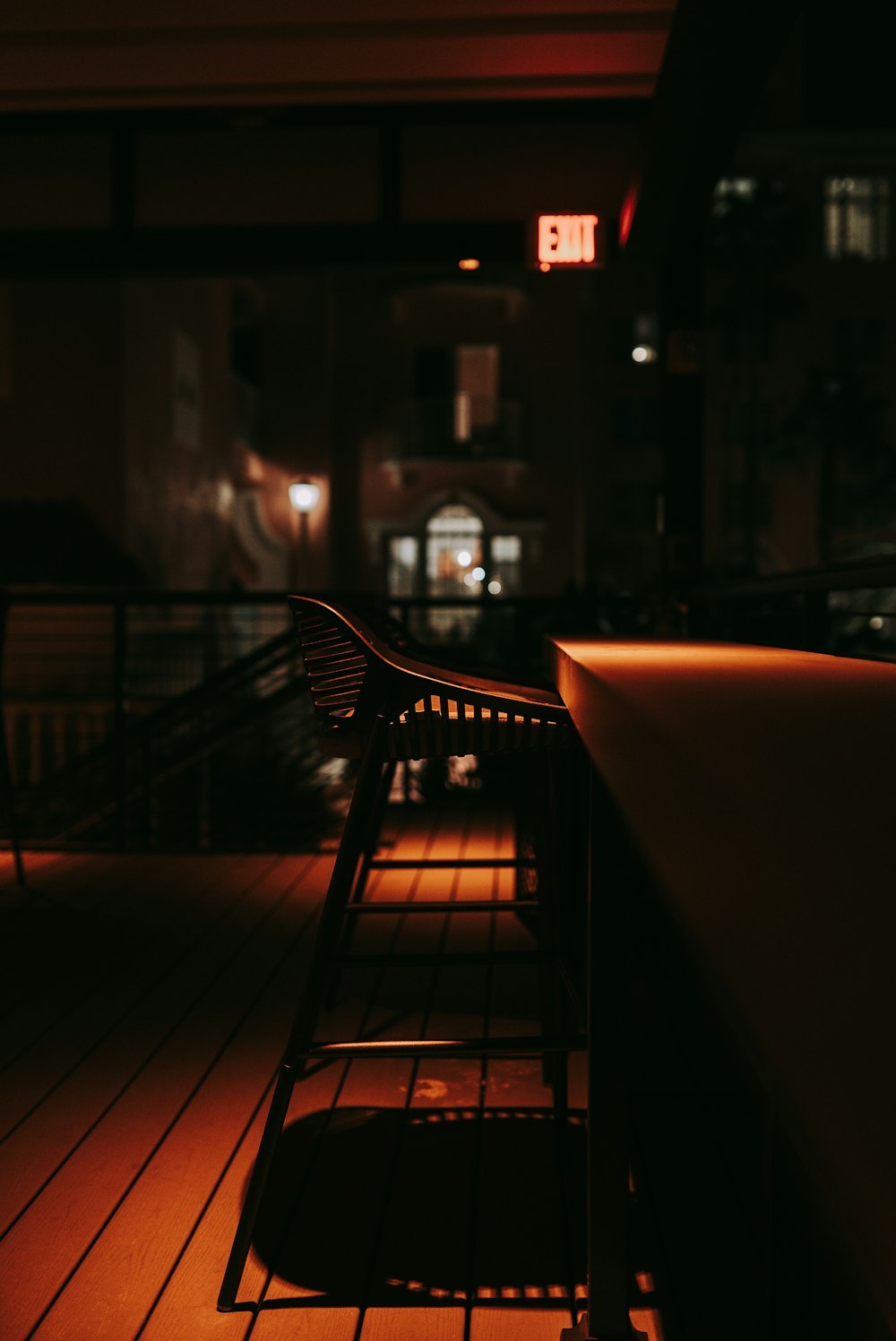 a bench sitting on top of a wooden floor