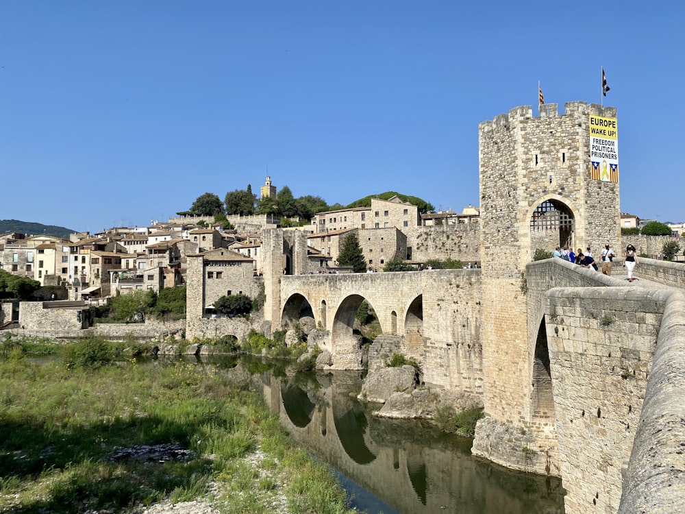 a stone bridge over a body of water