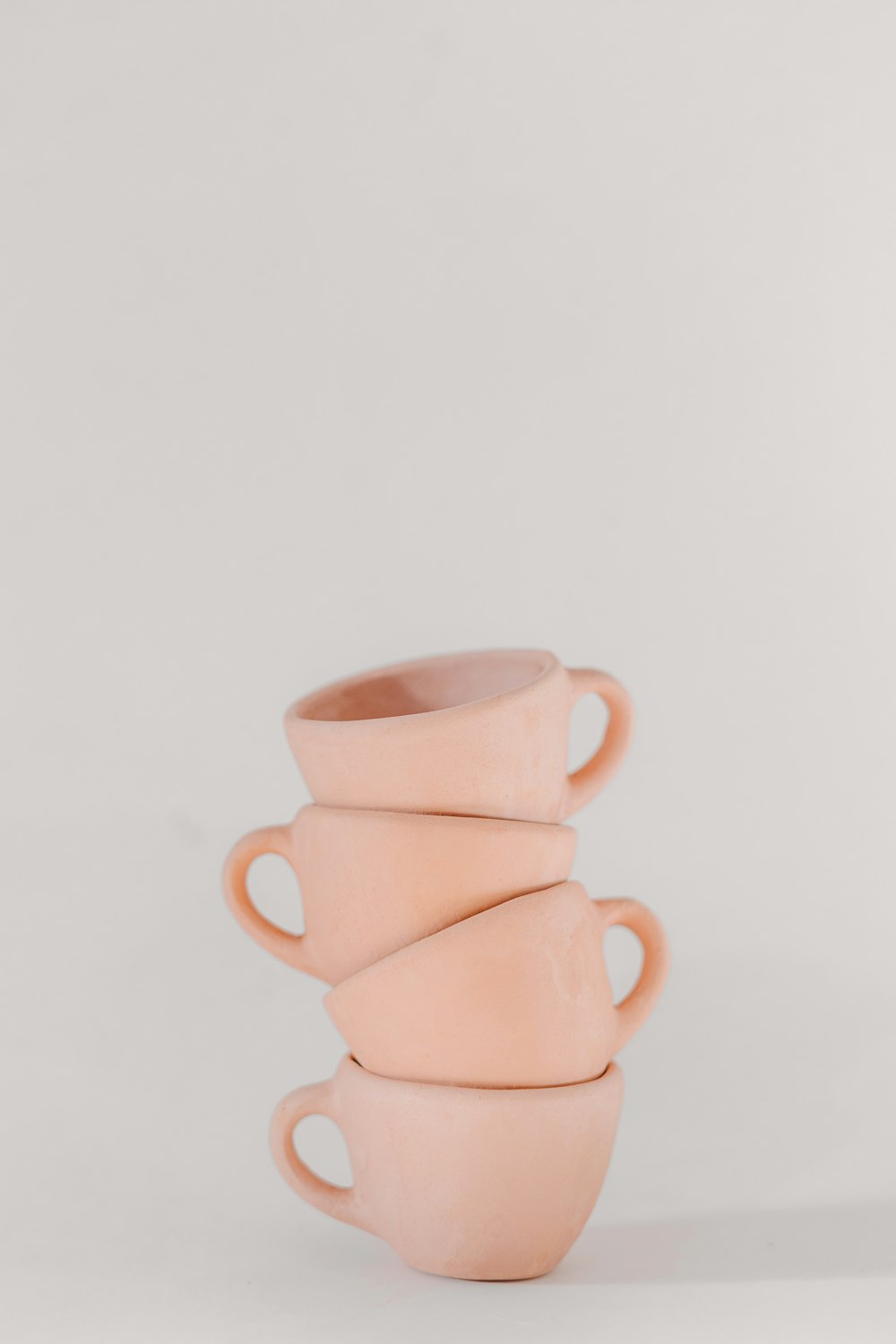 a stack of pink cups sitting on top of each other