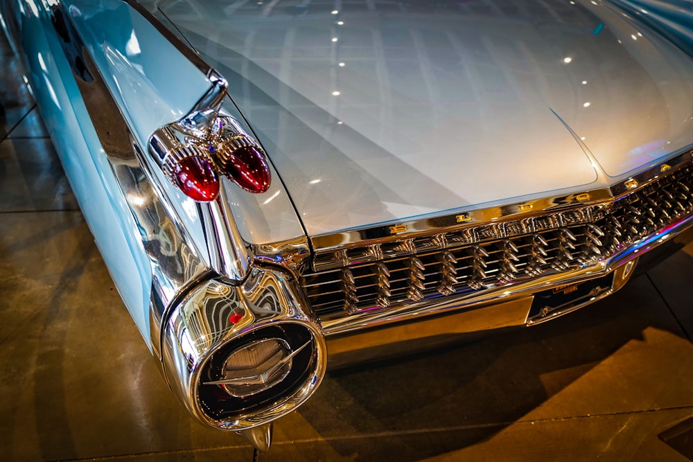 a close up of the front end of a classic car