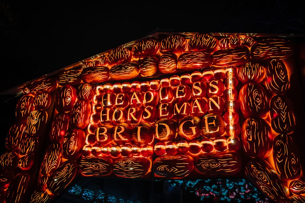 a lit up sign that says, headless horseman bridge
